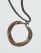 Leather necklace band with circular brass ornament - West Africa