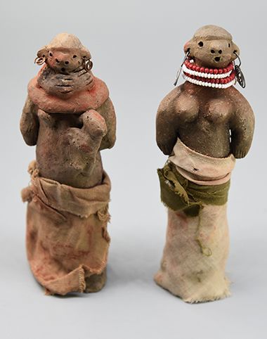 Two female clay dolls 
