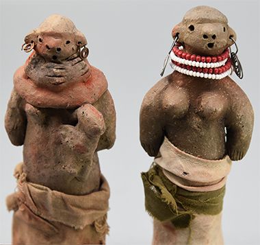 Two female clay dolls 
