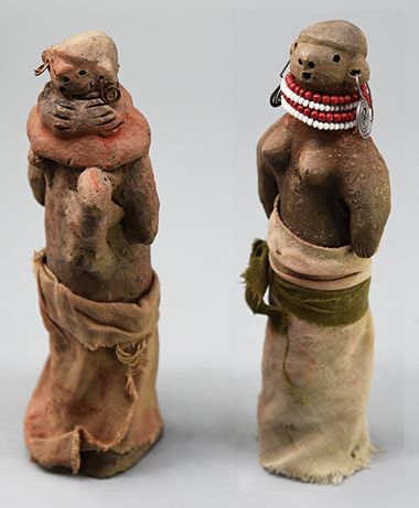 Two female clay dolls 